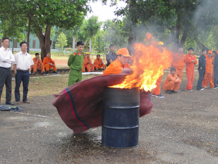 Extinguishing fire with a blanket