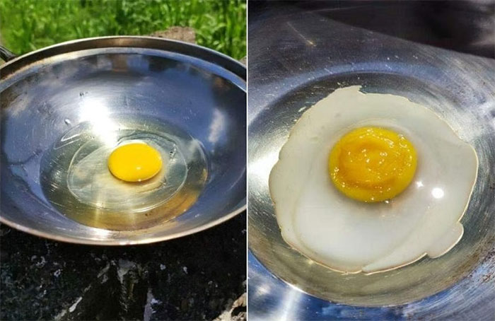 Một phụ nữ ở Malaysia đã chiên chín quả trứng trên chảo ở ngoài trời giữa nắng nóng hôm 12/5