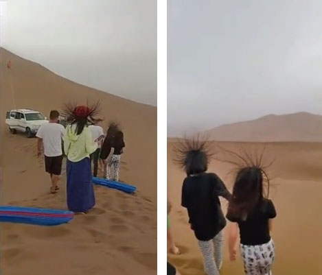 Tóc du khách dựng đứng khi đi trong sa mạc.