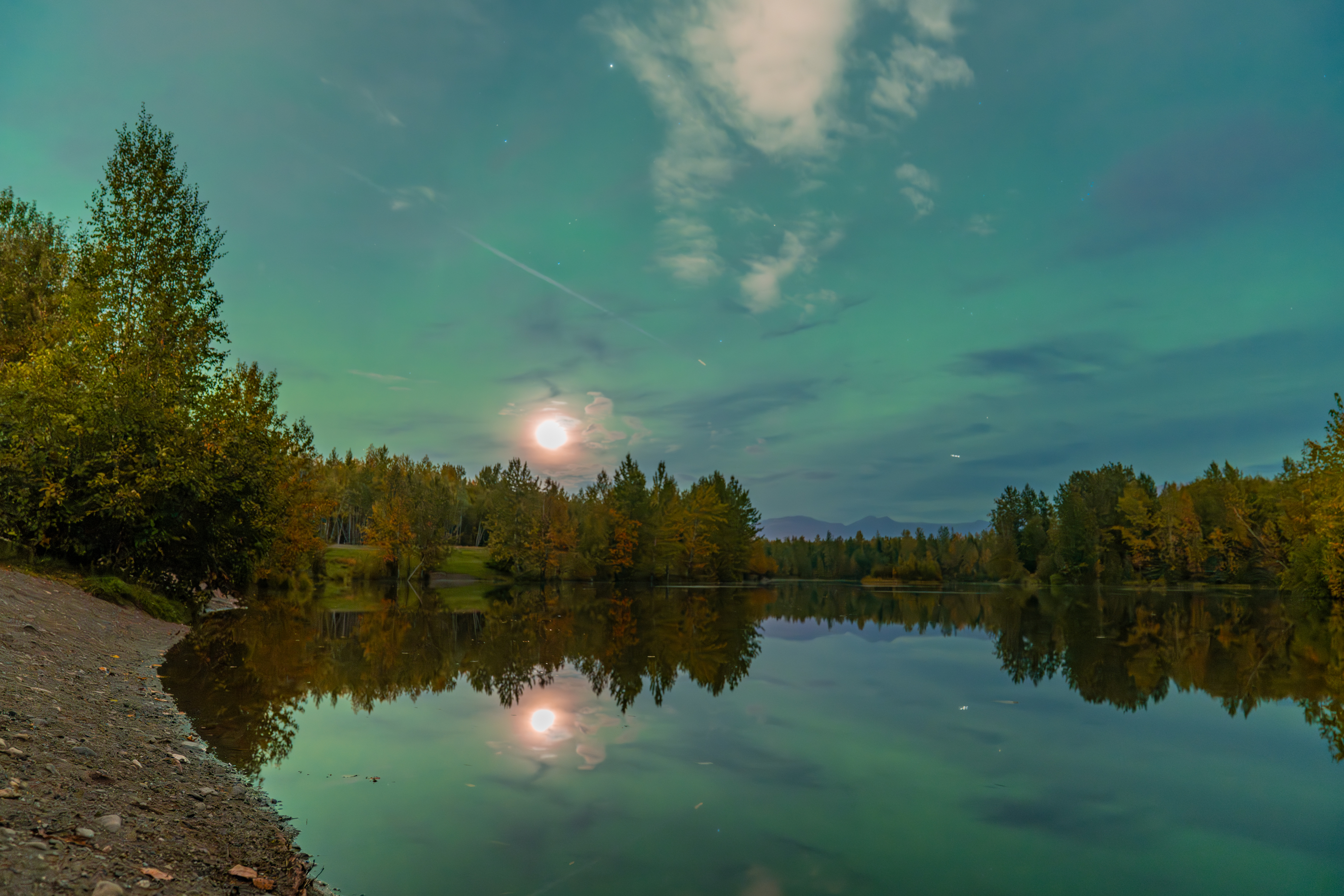 green northern lights above Anchorage, Alaska on Sept. 15. The aurora appears as a green ribbon in the sky.
